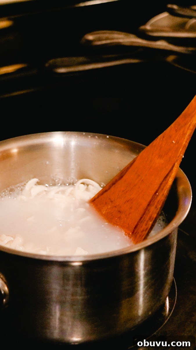 Make Your Own Laundry Soap: Simple DIY Recipe for Clean Clothes 8 Melting the soap bar on the stovetop before adding it to the laundry detergent.