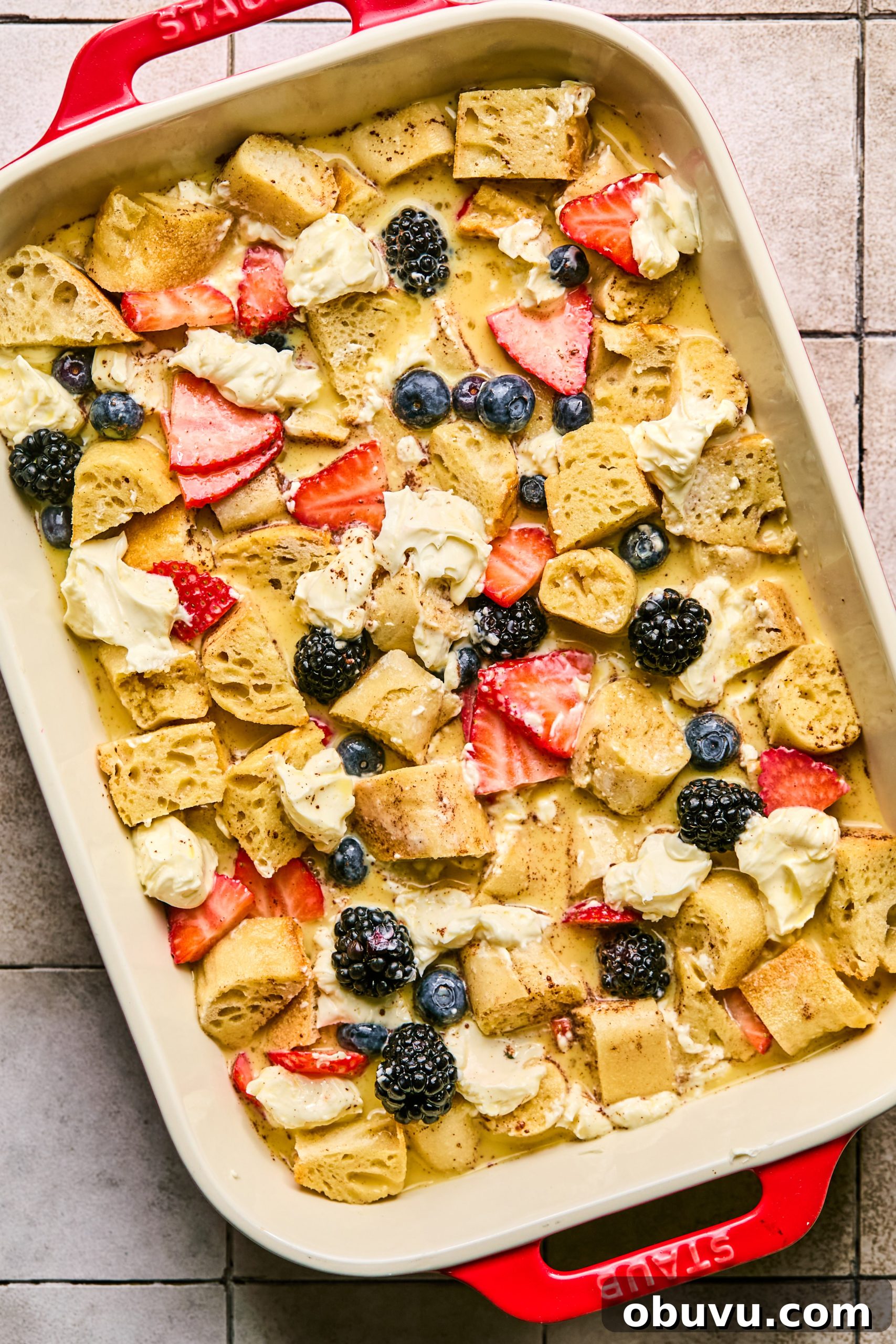 Berries and Cream French Toast Casserole Recipe 6 Overnight berries and cream french toast casserole assembled in a baking pan ready to be baked in the oven