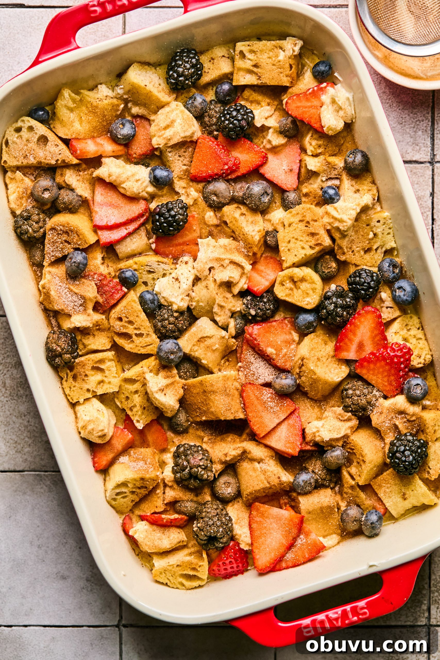 Berries and Cream French Toast Casserole Recipe 7 An assembled french toast casserole sprinkled with cinnamon sugar