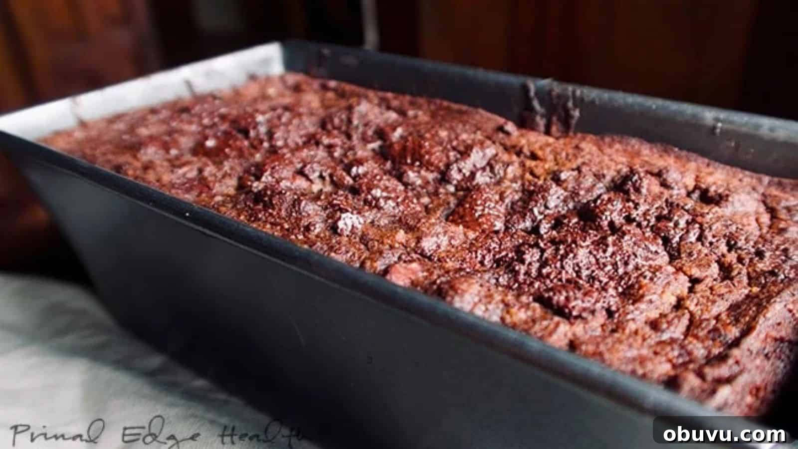 19 Cozy Low-Carb Breakfasts You’ll Crave Every Morning 5 A close-up of a freshly baked loaf of chocolate pumpkin bread in a black metal pan.