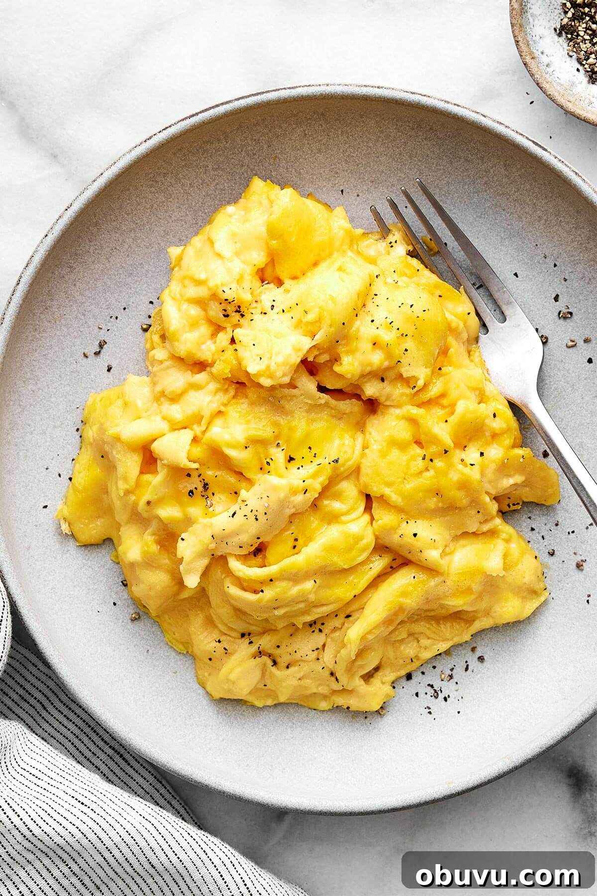 20 High-Protein Breakfast Recipes for Lasting Energy 18 A plate of scrambled eggs.
