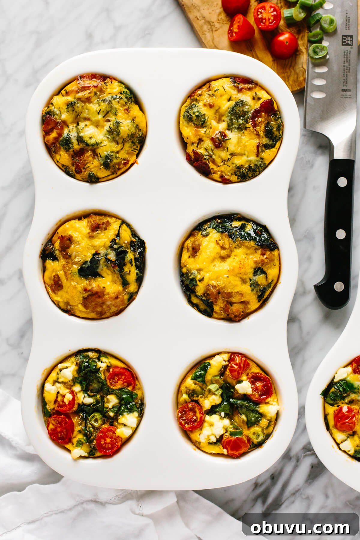 20 High-Protein Breakfast Recipes for Lasting Energy 6 Egg muffins in a pan.
