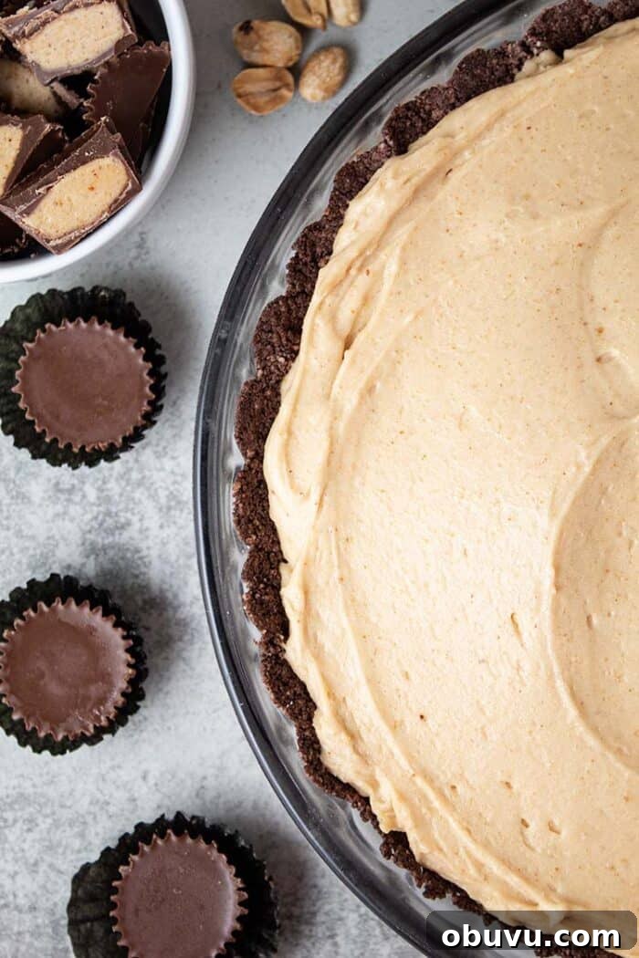 Keto Iced Coffee with 4 Ingredients: Creamy Low-Carb Recipe 12 overhead view of keto peanut butter pie in a glass pie dish and 3 sugar free reese's mini cups next to it