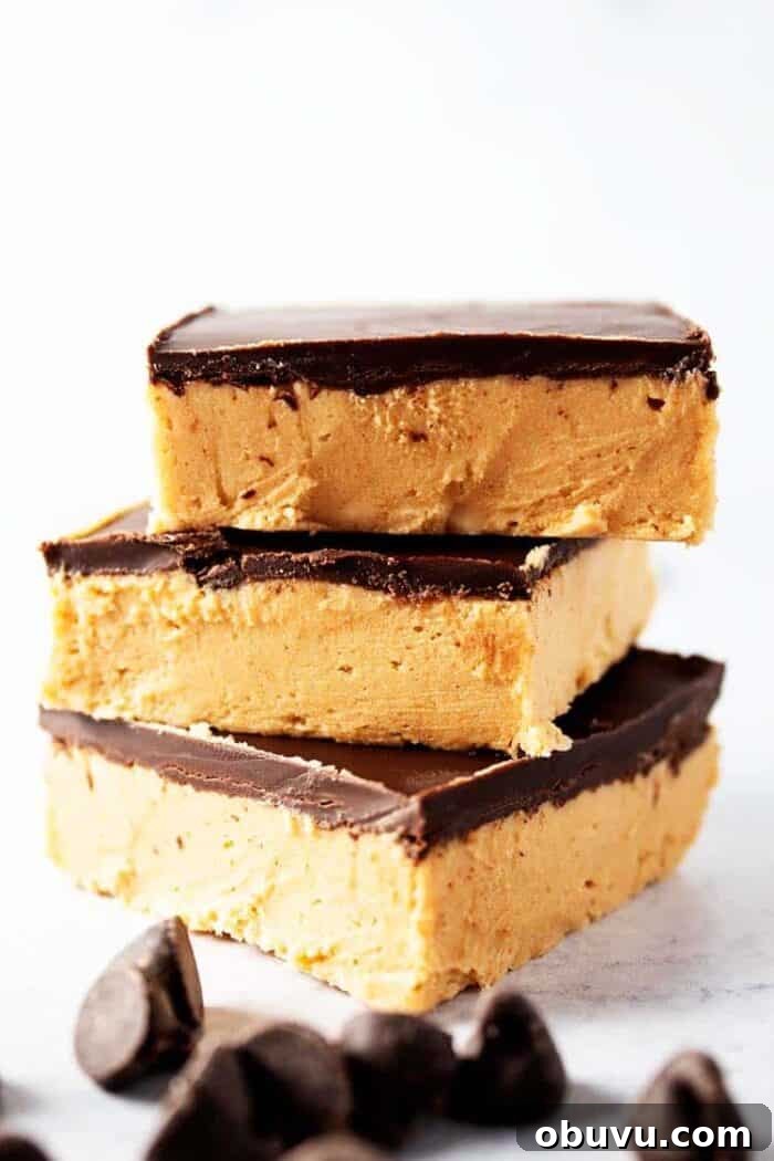 Keto Iced Coffee with 4 Ingredients: Creamy Low-Carb Recipe 13 side view of three pieces of keto no bake peanut butter bars with chocolate chips scattered in front