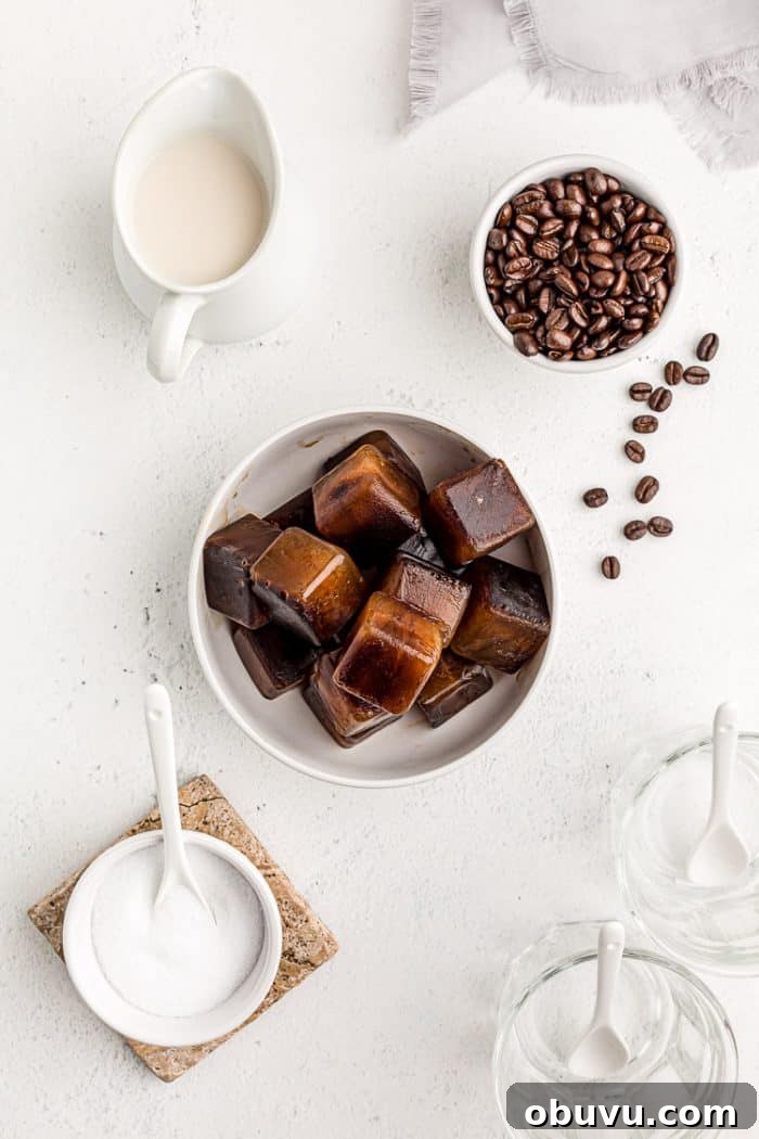 Keto Iced Coffee with 4 Ingredients: Creamy Low-Carb Recipe 3 overhead view of bowl of keto iced coffee cubes next to milk
