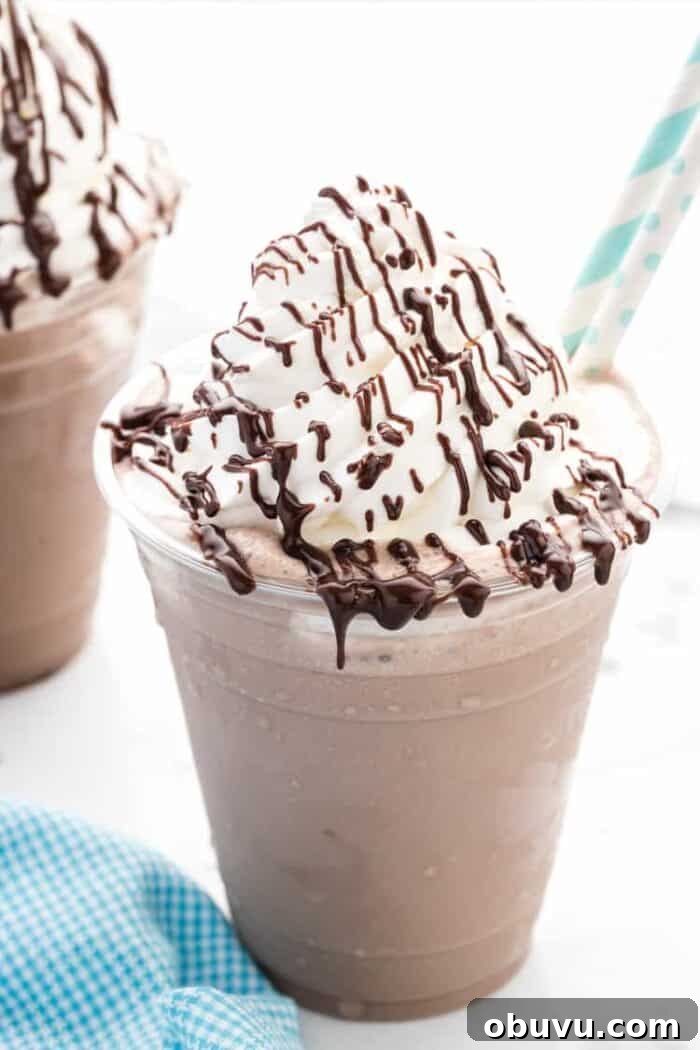 Keto Iced Coffee with 4 Ingredients: Creamy Low-Carb Recipe 7 keto nutella frappuccino in a clear cup with blue straws
