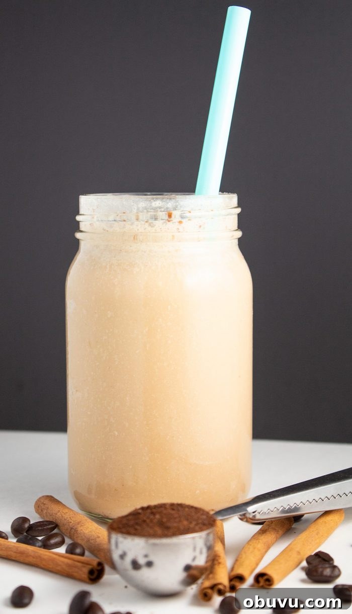 Keto Iced Coffee with 4 Ingredients: Creamy Low-Carb Recipe 8 vanilla cinnamon keto iced coffee in front of a black background by coffee beans