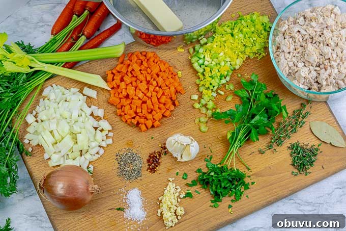 Creamy Turkey and Chicken Soup Recipe for Comforting Meals 4 ingredients for cream of turkey or chicken soup being prepped on wooden cutting board