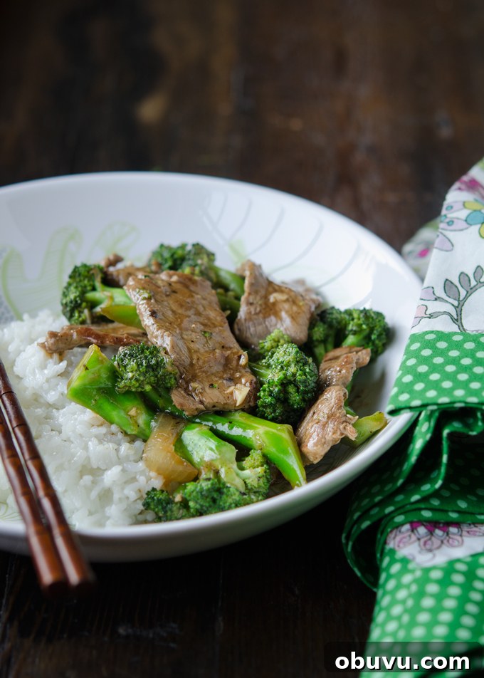 Chinese Beef and Broccoli Stir-Fry Recipe with Savory Sauce 2 Beef broccoli stir-fry served with rice in a bowl as a rice bowl dish.