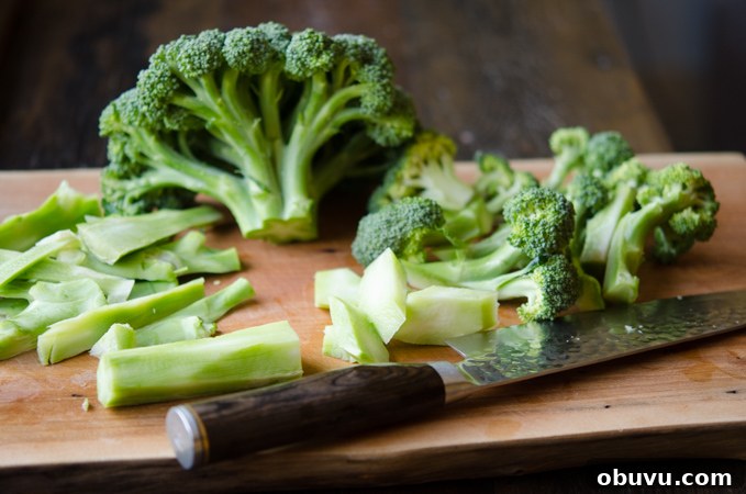 Chinese Beef and Broccoli Stir-Fry Recipe with Savory Sauce 6 A head of broccoli cut into florets and stems are saved.