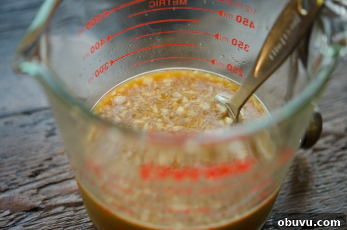 Chinese Beef and Broccoli Stir-Fry Recipe with Savory Sauce 7 Beef stir-fry sauce ingredients mixed in a glass measuring cup.