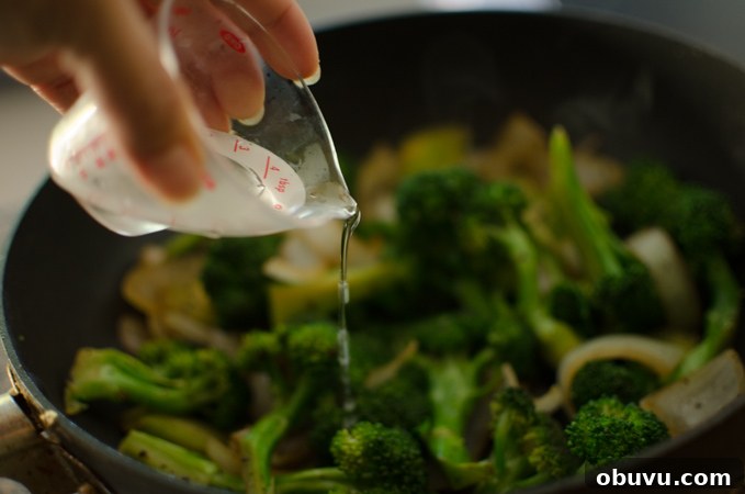Chinese Beef and Broccoli Stir-Fry Recipe with Savory Sauce 9 A small amount of water added to broccoli stir-fry.