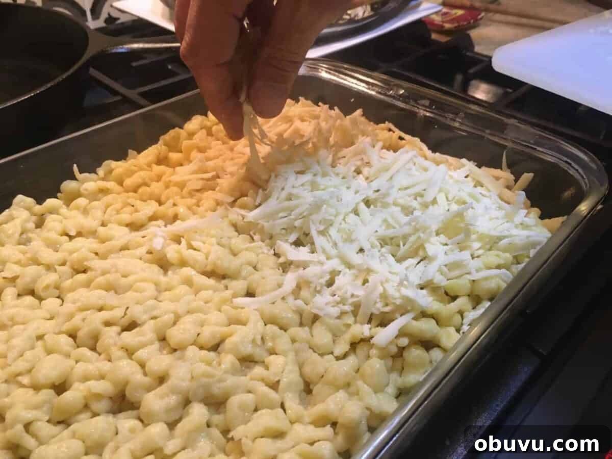 Sprinkle, sprinkle all the cheese.