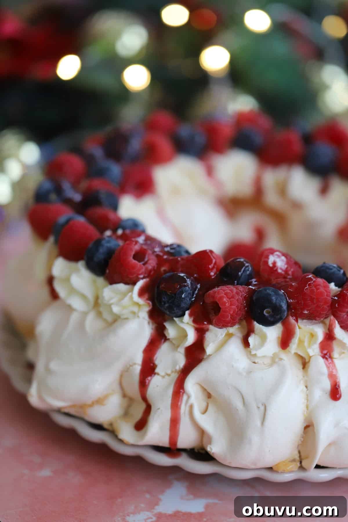 A close up of a Christmas wreath pavlova.