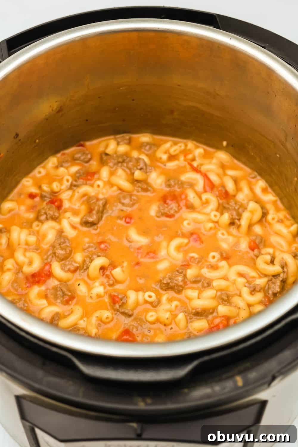 an Instant Pot pressure cooker with cheeseburger macaroni (copycat Hamburger Helper) in it.